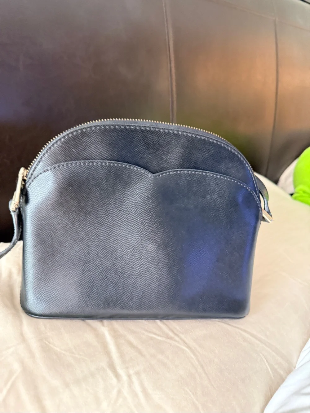 Kate Spade New York Payton Dome Crossbody in black saffiano leather.
